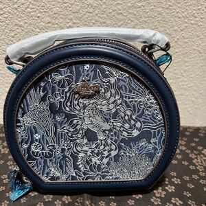 Blue China style shell bag with handle and shoulder strap, leather texture